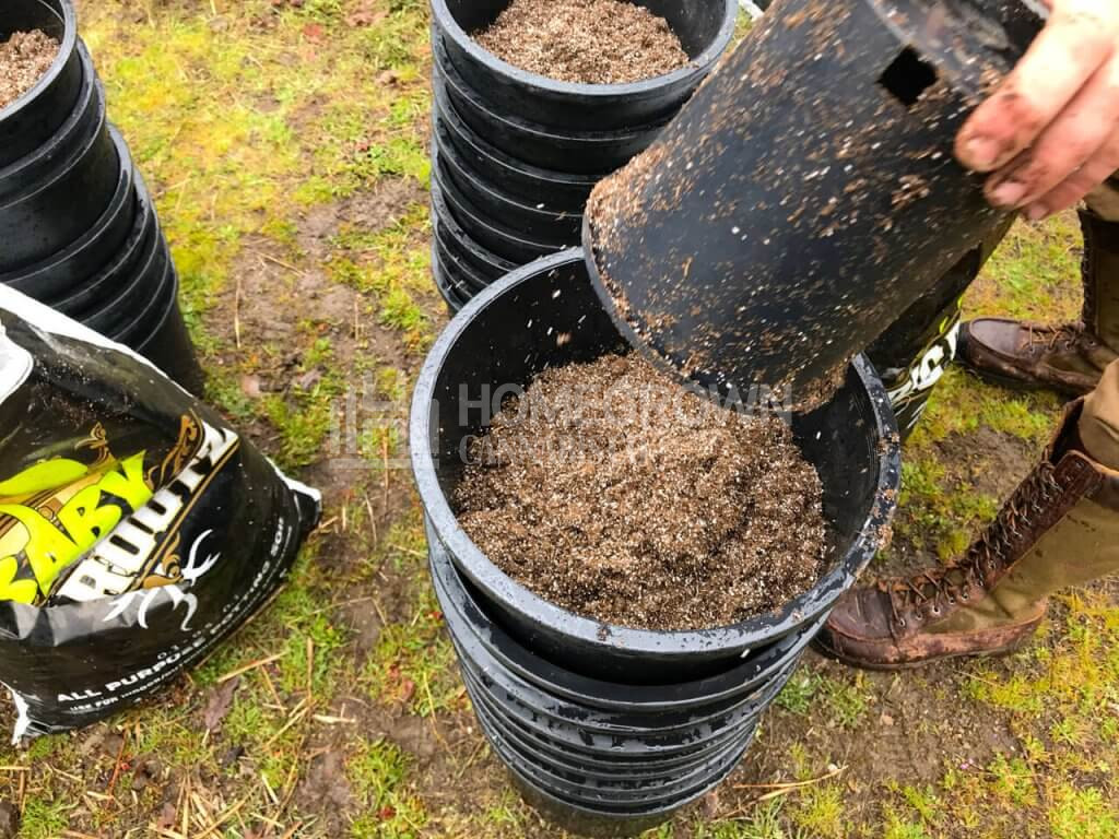 filling pots with soil